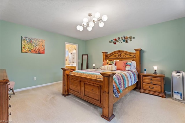 bedroom with light colored carpet, connected bathroom, and baseboards