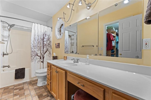 full bathroom with shower / tub combo, toilet, and vanity