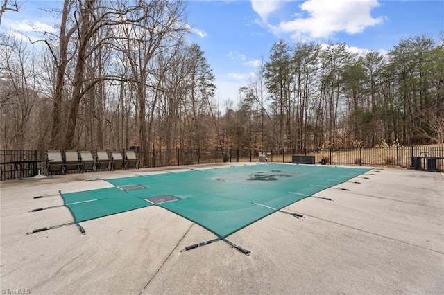 view of pool with a fenced in pool, a patio, and fence