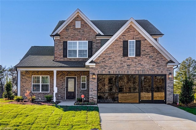 407 Brooke Hill Dr, Lewisville, NC 27023 - craftsman inspired home with a front yard, concrete driveway, stone siding, and a shingled roof