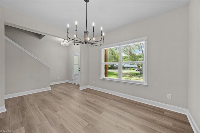 1337 Union Cross Rd, Kernersville, NC 27284 - unfurnished dining area featuring wood finished floors and a chandelier