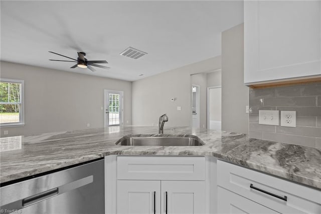 1337 Union Cross Rd, Kernersville, NC 27284 - kitchen with stainless steel dishwasher, healthy amount of natural light, light stone counters, and ceiling fan