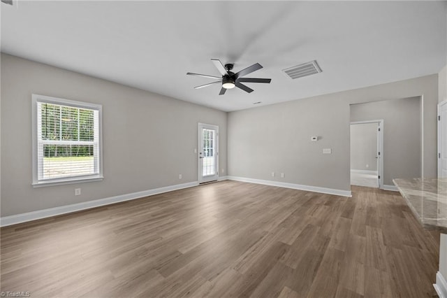1337 Union Cross Rd, Kernersville, NC 27284 - empty room with a ceiling fan, plenty of natural light, and wood finished floors