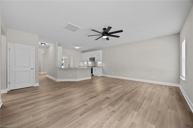1337 Union Cross Rd, Kernersville, NC 27284 - unfurnished living room featuring ceiling fan and light wood-type flooring