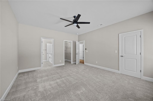 1337 Union Cross Rd, Kernersville, NC 27284 - unfurnished bedroom featuring carpet, a spacious closet, connected bathroom, and ceiling fan