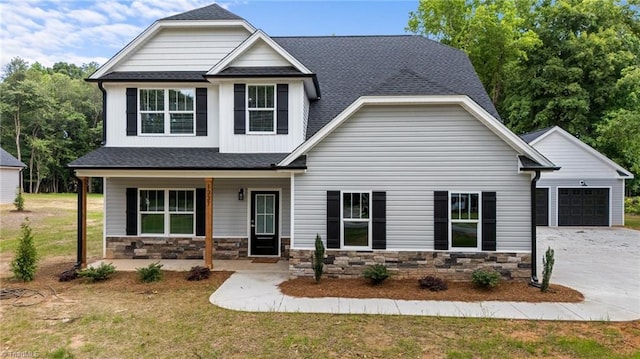 1337 Union Cross Rd, Kernersville, NC 27284 - craftsman-style house featuring a porch, driveway, a garage, stone siding, and roof with shingles