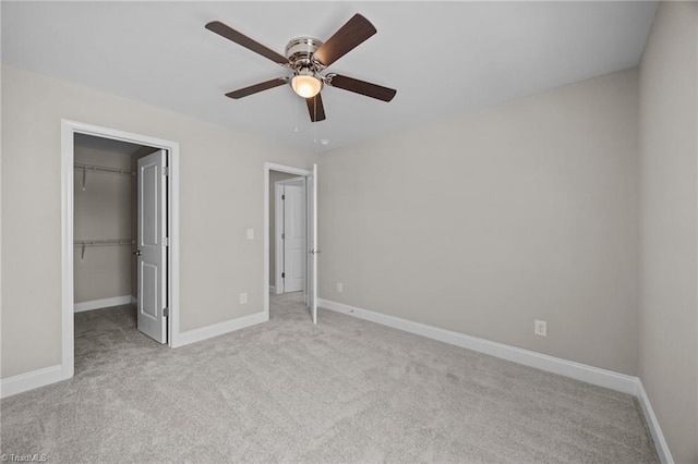 1337 Union Cross Rd, Kernersville, NC 27284 - unfurnished bedroom with carpet flooring, a walk in closet, a closet, and ceiling fan