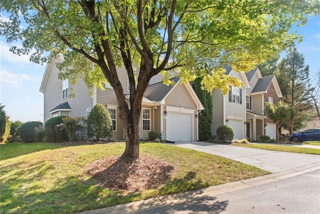 view of front of property with a front lawn and a garage