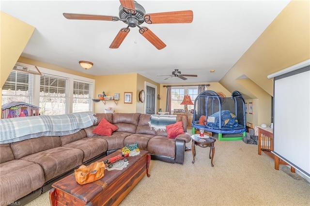 carpeted living room featuring vaulted ceiling