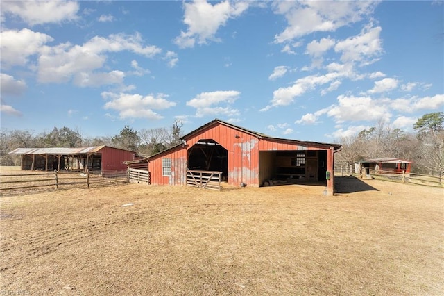 view of stable featuring a rural view