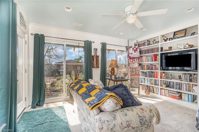 sitting room featuring ceiling fan and light colored carpet