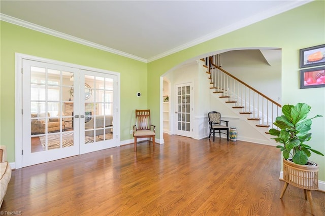 183 Scottsdale Dr, Advance, NC 27006 - sitting room featuring french doors, arched walkways, crown molding, stairway, and wood finished floors