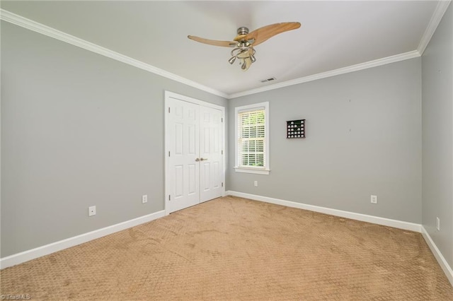 183 Scottsdale Dr, Advance, NC 27006 - unfurnished bedroom with ornamental molding, baseboards, carpet, a closet, and ceiling fan