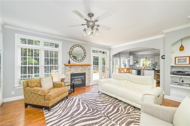 183 Scottsdale Dr, Advance, NC 27006 - living area with a ceiling fan, crown molding, plenty of natural light, and arched walkways