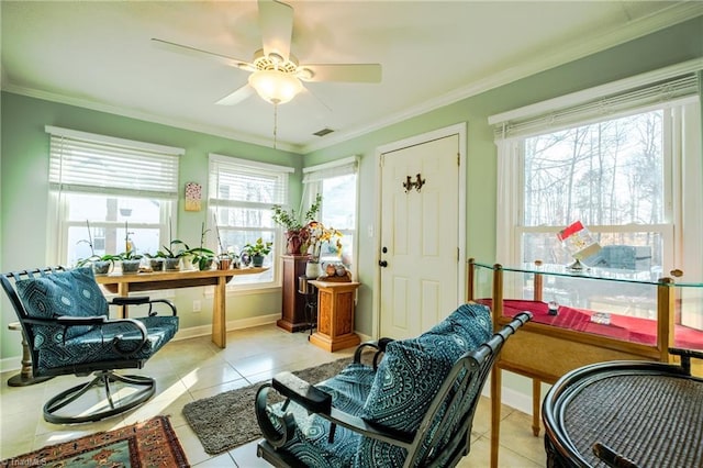 sitting room with ornamental molding, a wealth of natural light, ceiling fan, and light tile patterned floors