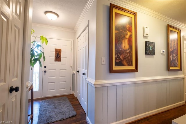 doorway featuring dark hardwood / wood-style flooring and crown molding