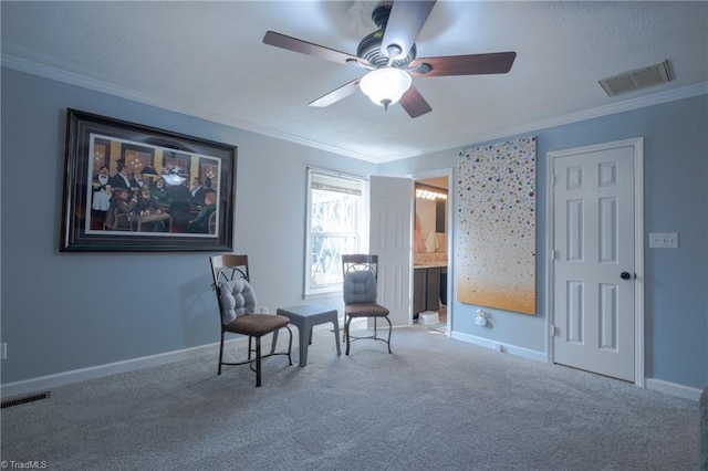 living area featuring crown molding, carpet floors, and ceiling fan