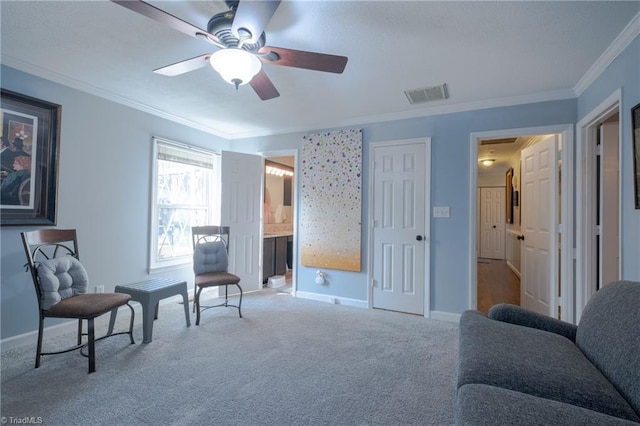 living area featuring ceiling fan, ornamental molding, and carpet flooring