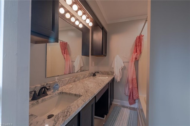 bathroom with ornamental molding, shower / bathtub combination with curtain, and vanity