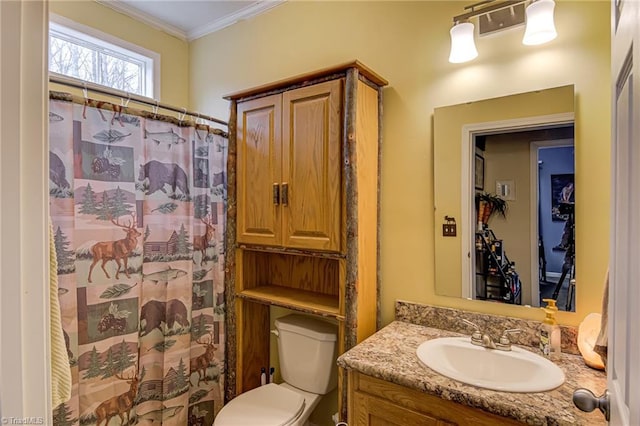 bathroom featuring toilet, a shower with curtain, crown molding, and vanity