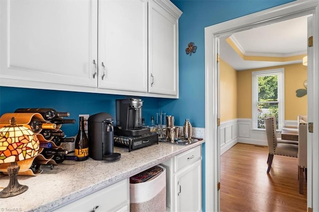 4802 Worchester Pl, Jamestown, NC 27282 - bar area with wood finished floors, wainscoting, crown molding, and a raised ceiling