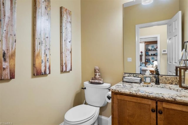 4802 Worchester Pl, Jamestown, NC 27282 - half bath featuring toilet, vanity, and baseboards