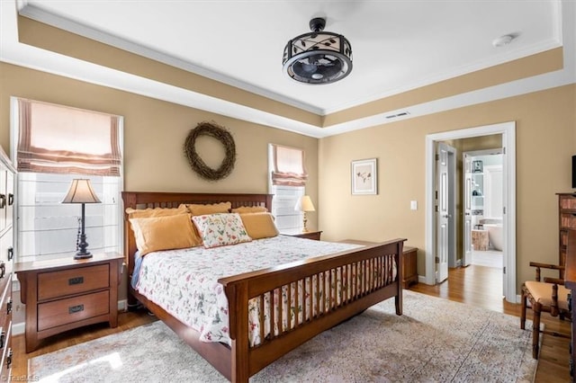 4802 Worchester Pl, Jamestown, NC 27282 - bedroom with a tray ceiling, wood finished floors, crown molding, and baseboards