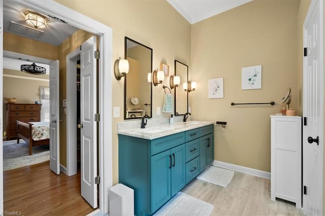 4802 Worchester Pl, Jamestown, NC 27282 - ensuite bathroom featuring crown molding, wood finished floors, baseboards, and double vanity