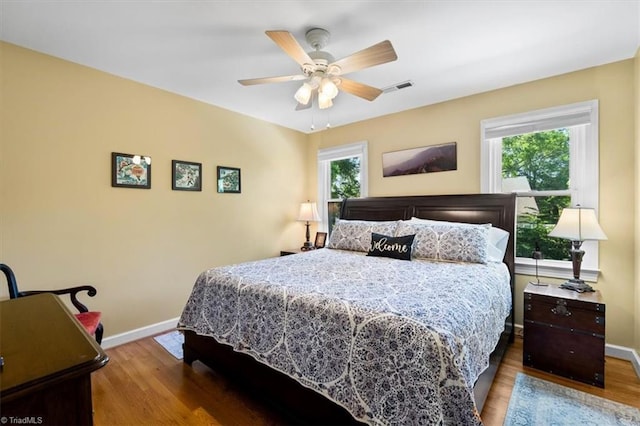 4802 Worchester Pl, Jamestown, NC 27282 - bedroom featuring wood finished floors, baseboards, and ceiling fan