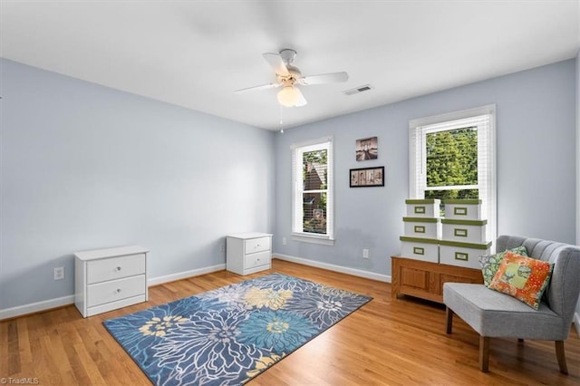 4802 Worchester Pl, Jamestown, NC 27282 - sitting room with a ceiling fan, baseboards, and wood finished floors