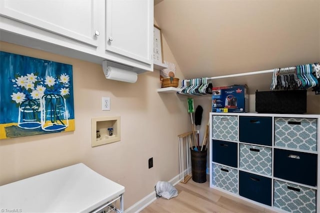 4802 Worchester Pl, Jamestown, NC 27282 - laundry area featuring washer hookup, cabinet space, light wood-style floors, and baseboards