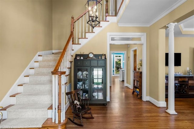 4802 Worchester Pl, Jamestown, NC 27282 - staircase with wood finished floors, ornate columns, baseboards, and ornamental molding