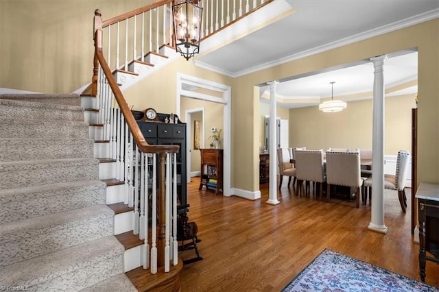 4802 Worchester Pl, Jamestown, NC 27282 - stairs with decorative columns, crown molding, wood finished floors, and baseboards