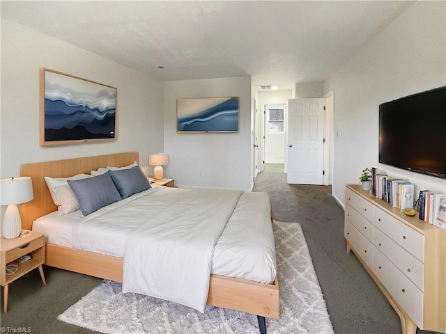 carpeted bedroom featuring visible vents