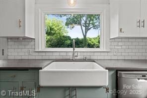 720 Ferndale Blvd, High Point, NC 27262 - kitchen with a sink, stainless steel dishwasher, white cabinets, and tasteful backsplash