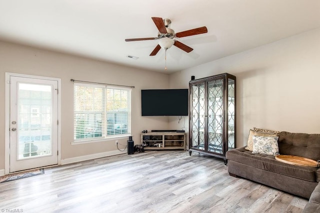 living room with ceiling fan and wood-type flooring