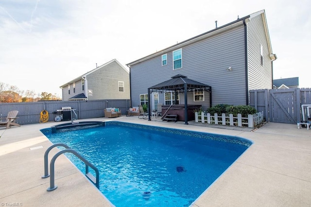 view of pool with a gazebo, a patio area, and a hot tub