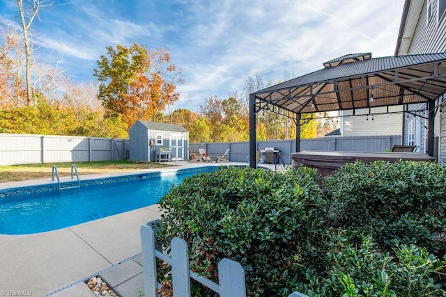 view of pool with a gazebo, a patio area, an outbuilding, and a hot tub