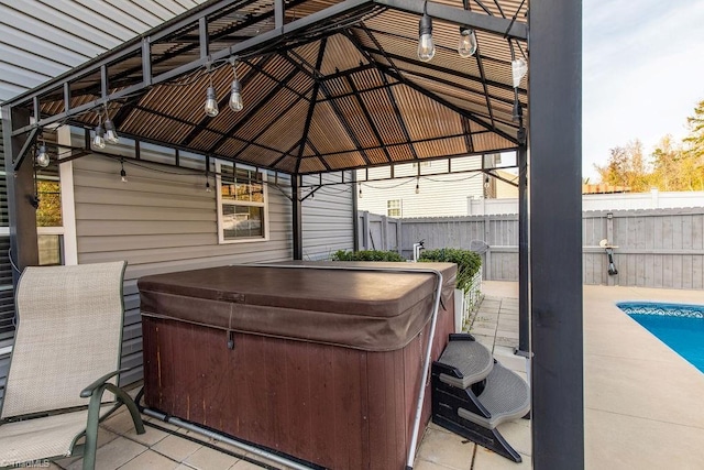 view of patio / terrace with a gazebo and a hot tub