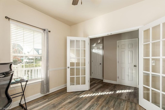 interior space featuring dark hardwood / wood-style floors, ceiling fan, and french doors