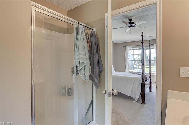 full bath with a shower stall, a textured ceiling, connected bathroom, and ceiling fan