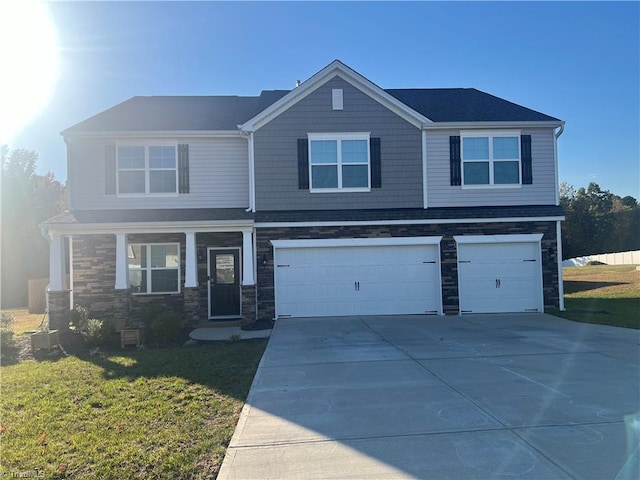 view of front of house featuring a front yard and a garage