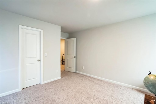 unfurnished bedroom with carpet floors