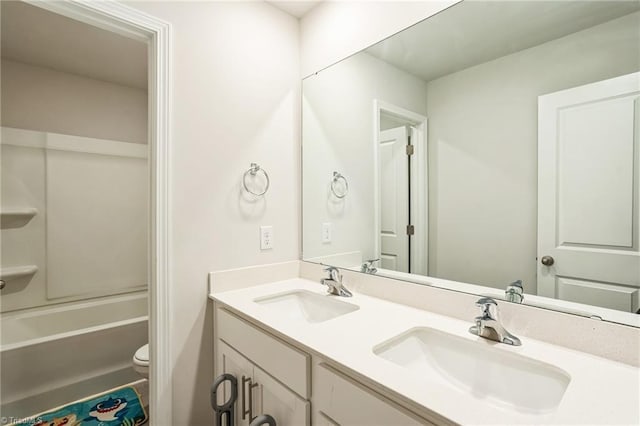 full bathroom with vanity, toilet, and shower / washtub combination