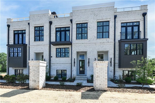 view of front of home with brick siding