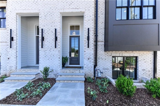 property entrance with brick siding