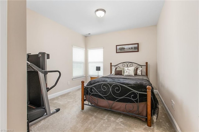 bedroom featuring carpet flooring and baseboards