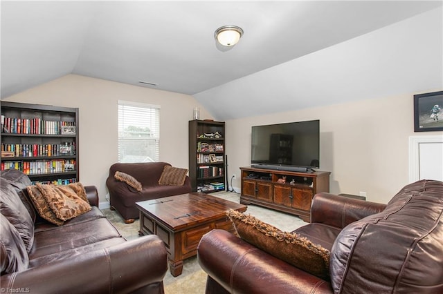 living room featuring visible vents, lofted ceiling, and carpet floors