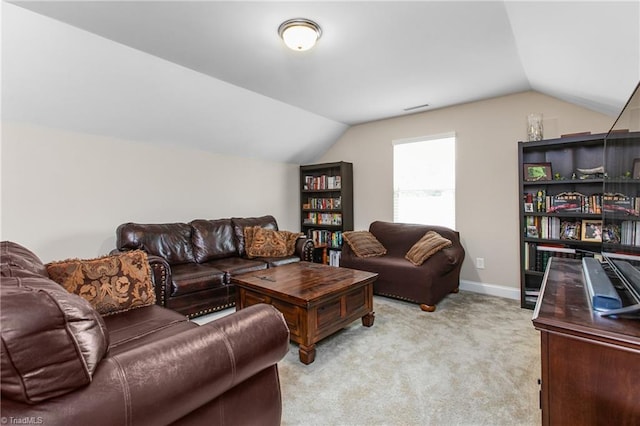 living room featuring baseboards, light carpet, visible vents, and vaulted ceiling