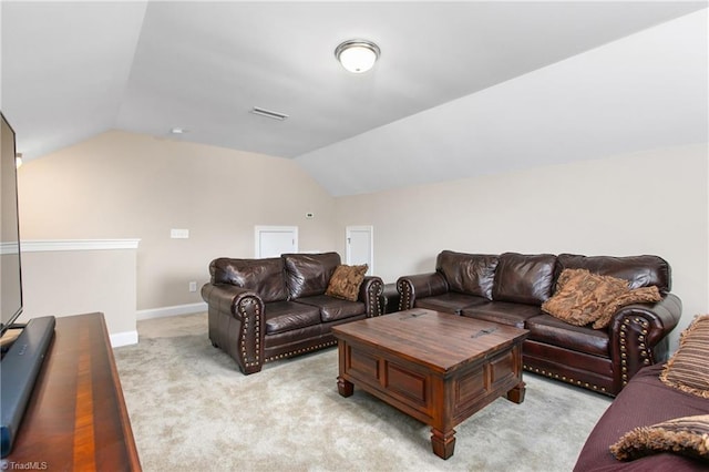 living room with light colored carpet, lofted ceiling, baseboards, and visible vents